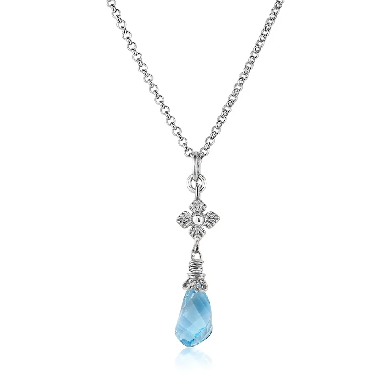 Hemp cord necklaces-Faceted Blue Topaz Twist Necklace with Flower Detail in Silver